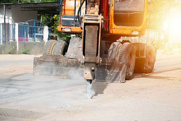 istock Large excavators drilling roads in road construction work 2227126854