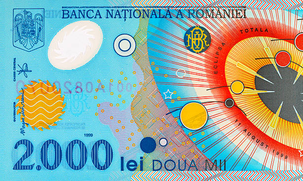 istock 2000 Lei Romania, 1999 with a simplified Solar System and a solar eclipse. Polymer money of Romania and Europe. 2227127015