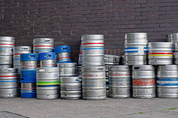 istock Beer and alcohol barrel kegs in a stack outside pub 2227132142