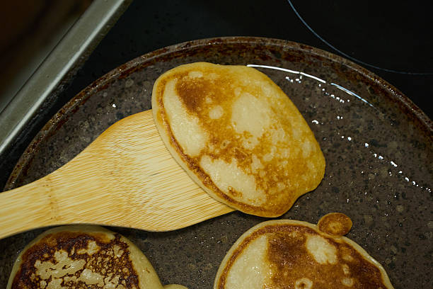 istock Ready Pancakes on Skillet with Wooden Spatula 2227132353