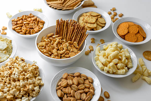 istock Different delicious crackers in bowls 2227132781