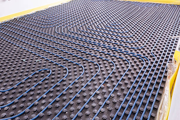 istock System of underfloor heating. Installation of a heat flooring system. Modern heating system in a new home 2227133939