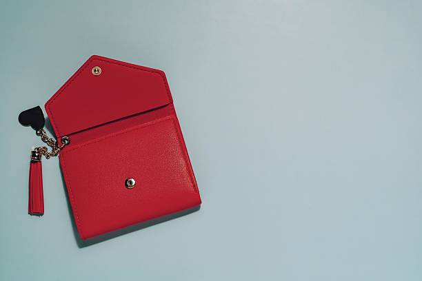 Open Red Wallet with Tassel Keychain on Blue