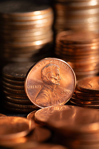 istock A stack of dollar coins stacked on each other in different positions. Money 2227136950
