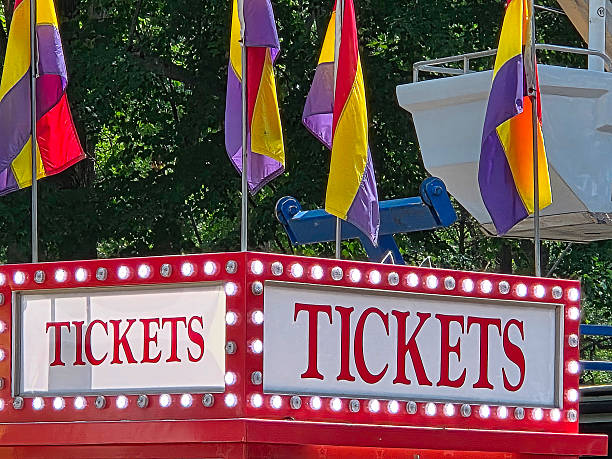 istock Carnival Ticket Sign With Lights and Flags 2227138256