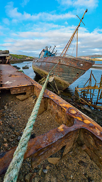 istock old abandoned sunken ship in the water at the ship cemetery wood pattern 2227143168