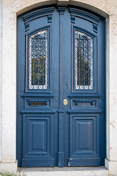 istock Elegant Blue Double Door with Decorative Glass Panes 2227146046