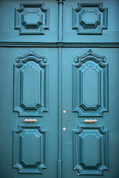 istock Ornate teal double doors with detailed molding 2227146062