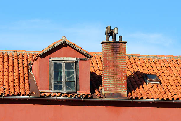 White smoke comes out of a house's chimney