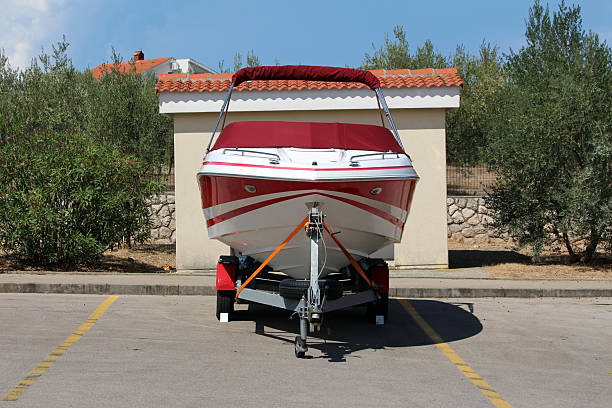 Sailboat being lifted by a travel lift for maintenance in Kastel marina