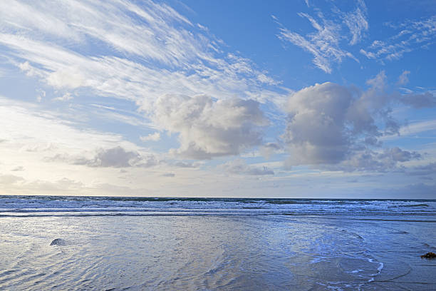 Calm coastal waters of Jekyll Island stretch toward the horizon, framed by marshlands and soft natural light.
