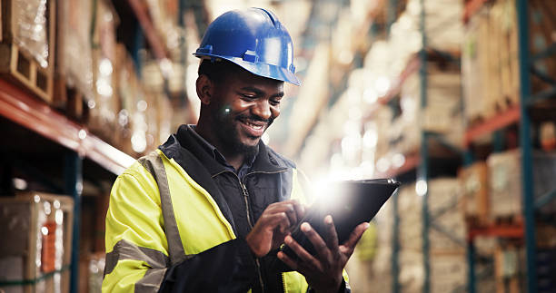 istock Smile, supply chain and black man in warehouse, tablet and logistics with quality control. African person, employee and inspector in factory, distribution or check stock with manufacturing or export 2227171357