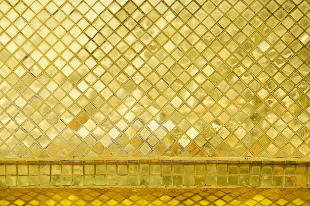 istock Shimmering Golden Mosaic Tiles with Reflective Surface Design 2227178668