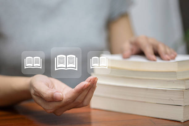 istock Books with Floating Digital Education Icons 2227179397