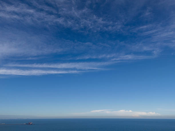 istock Calm Ocean Horizon with Cloudy Sky 2227181313