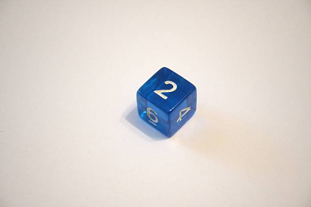 istock Single blue die showing number two on white background 2227186299
