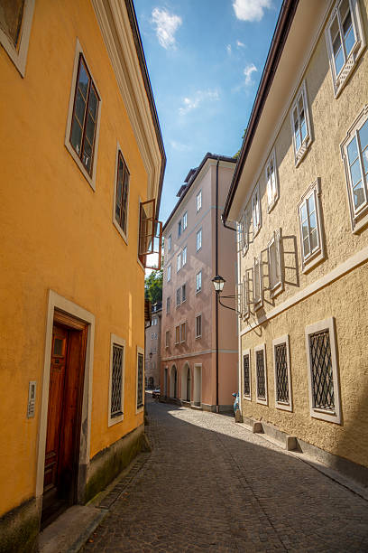Sunny summer day in the old town. Narrow winding street paved with cobblestones