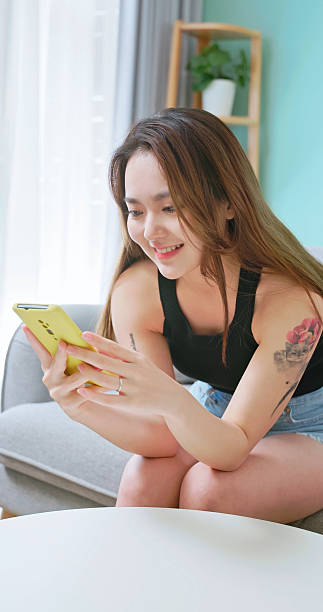 istock asian woman use mobile phone 2227193435