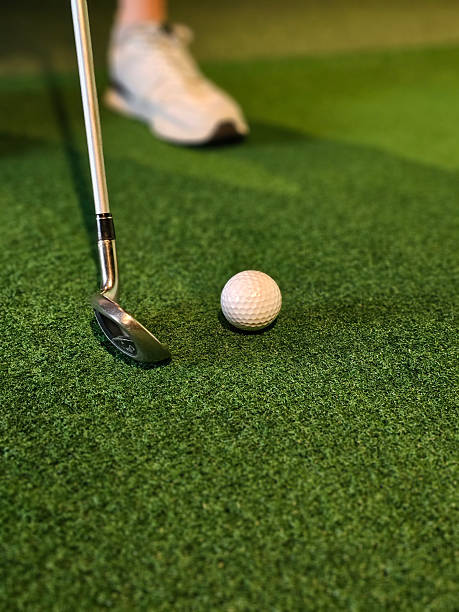 istock Golf swing practice on artificial turf with a white ball 2227194541
