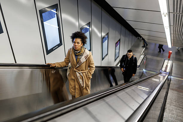 istock Beautiful multiracial woman on subway escalator 2227195584