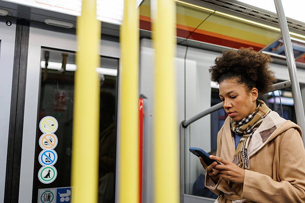 istock Portrait of beautiful multiracial woman using phone while commuting by subway train 2227195781