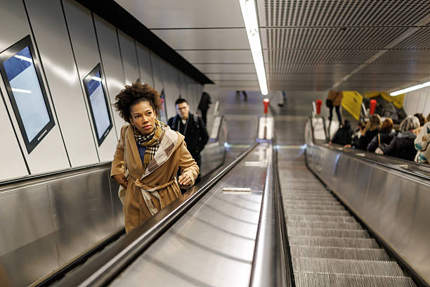 istock Beautiful multiracial woman on subway escalator 2227195929