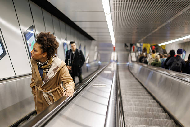 istock Beautiful multiracial woman on subway escalator 2227195939