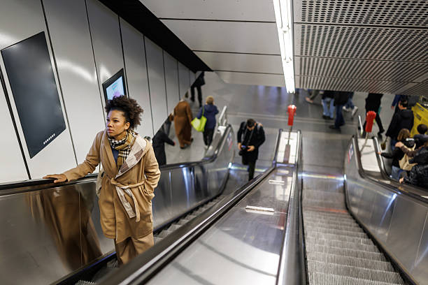 istock Beautiful multiracial woman on subway escalator 2227196695