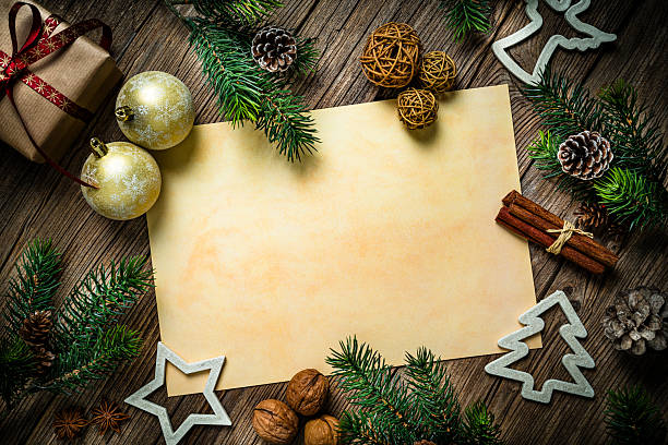 Blank greeting card or invitation for Christmas Holidays, rustic and old fashioned background. Flat lay and decor, gift box and fir tree border