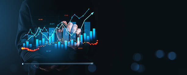 istock Businessman analyzing financial data on futuristic digital screen with graphs and charts on a dark background, showcasing the finance growth concept. 2227197621