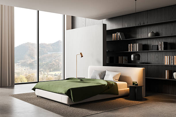 istock Modern minimalist bedroom interior with large window, green bedding, wood panel wall, and contemporary shelving concept in cozy natural light. 3D Rendering 2227197689