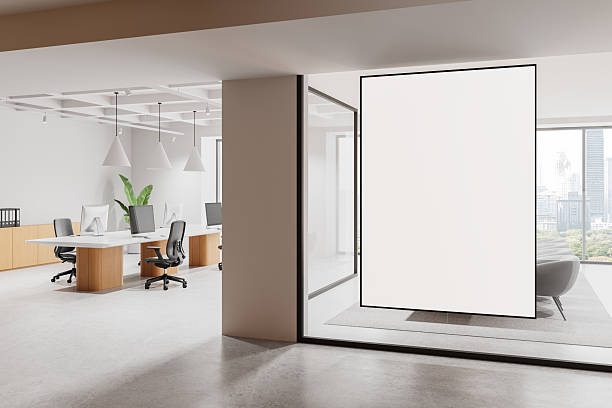 istock Modern open office interior with blank vertical screen and panoramic city view window in a bright workspace setting. 3D Rendering 2227197813
