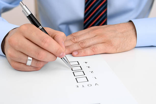 To vote in a ballot, to put a cross in a box on a piece of paper