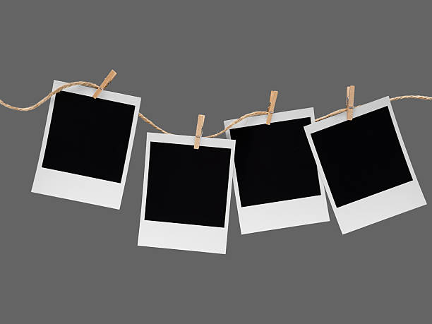 istock Aesthetic Blank Polaroids Hanging On A Rope 2227198506