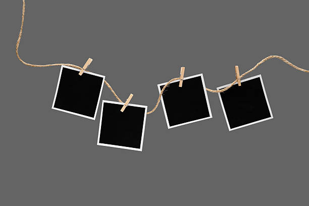 istock Aesthetic Blank Polaroids Hanging On A Rope 2227198508