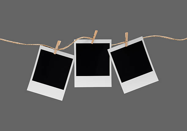 istock Aesthetic Blank Polaroids Hanging On A Rope 2227198509