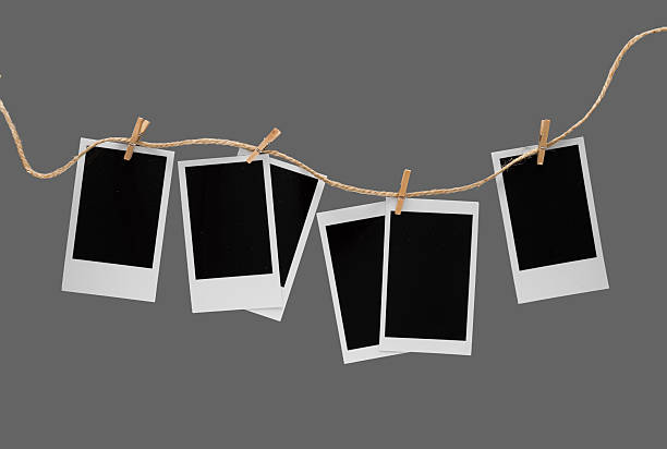 istock Aesthetic Blank Polaroids Hanging On A Rope 2227198525