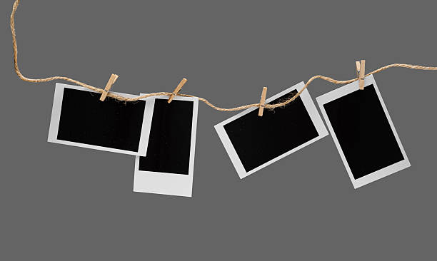 istock Aesthetic Blank Polaroids Hanging On A Rope 2227198527