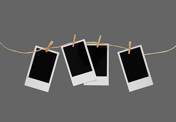 istock Aesthetic Blank Polaroids Hanging On A Rope 2227198532