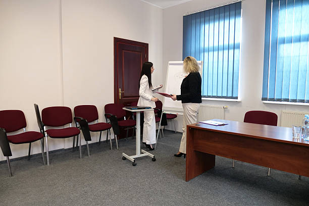 Interior Of Busy Modern Open Plan Office With Staff