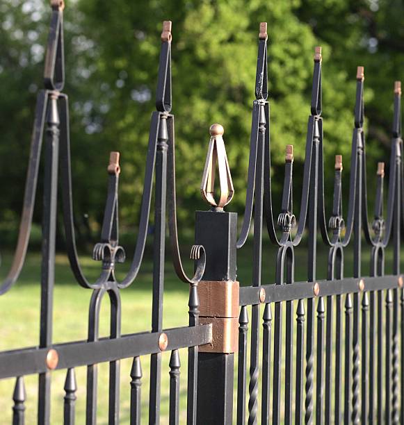 istock fence with gold decoration 2227205795
