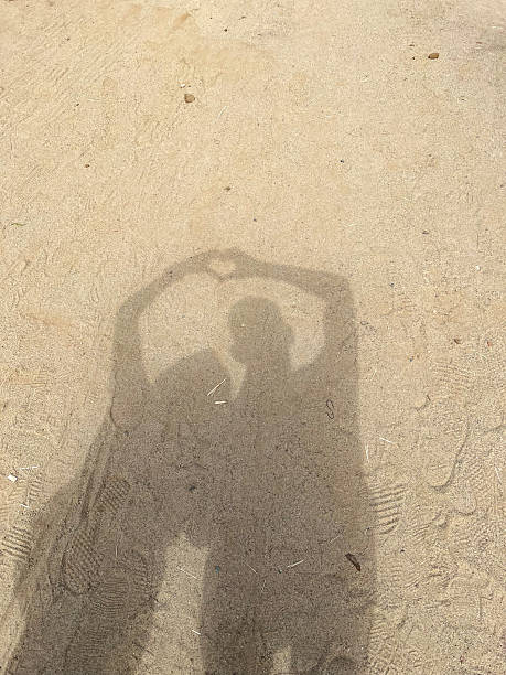 istock A couple is making a heart shape in the sand 2227209215