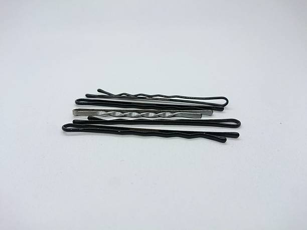 istock Pile of Black Bobby Pins on White Surface 2227209747