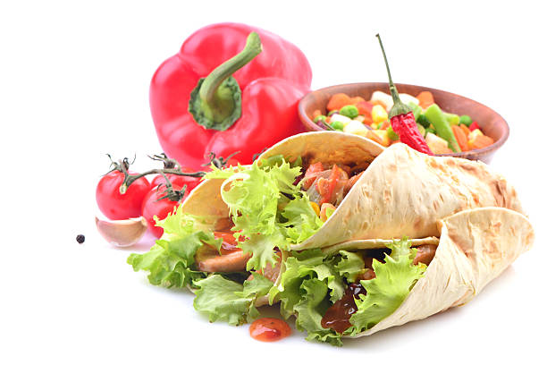Mexican burrito with chicken and vegetables on a white background