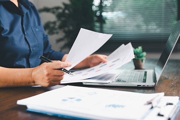 istock Office businesswoman hand to operate calculator analyzing financial data, counting costs on desk. accounting, financial analysis for business budget planning, calculation support, finance management. 2227211014