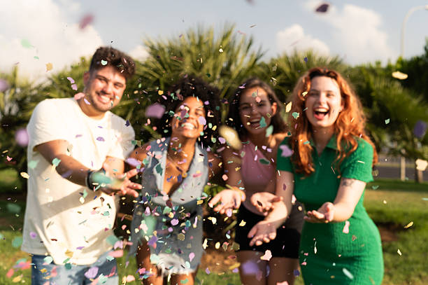 istock Friends throwing confetti at a festive celebration 2227211542