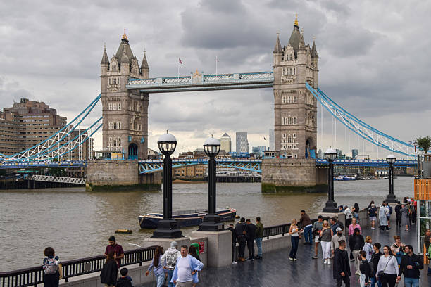 London, UK - July 22 2025:  people walk past Tower Bridge