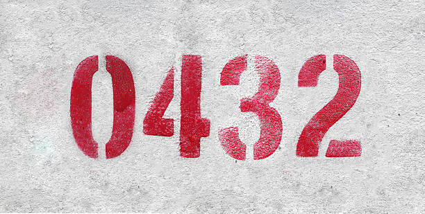 istock Red Number 0432 on the white wall. Spray paint. 2227213363