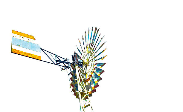 Aluminium silver old fashioned wind turbine in farm with Thailand flag pattern isolated on white background, for pumping water from underground or dams, so known as wind pumps, utilize blades to turn a rotor