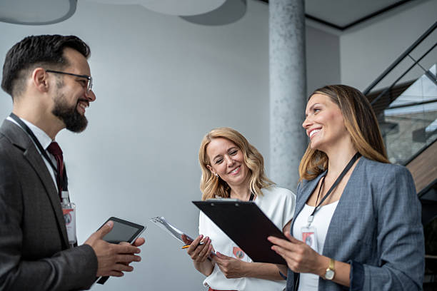 istock Business people discussing work in office hallway 2227215835